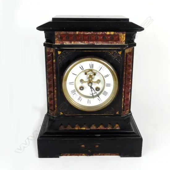 A black slate and porphyry cased mantel clock