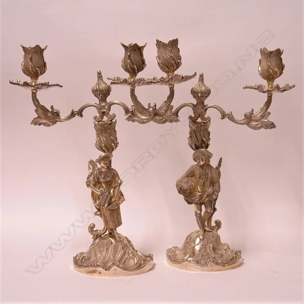 A pair of 20thC cast silver antique French style figured twin branch table candelabra Image 1++