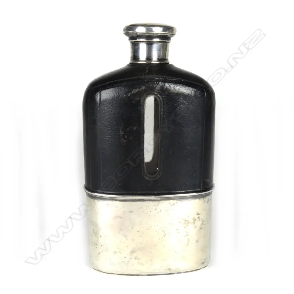 A Victorian silver leather and glass large hip flask Image 1++