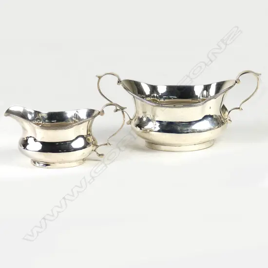 A pair of Edwardian silver sugar and creamer