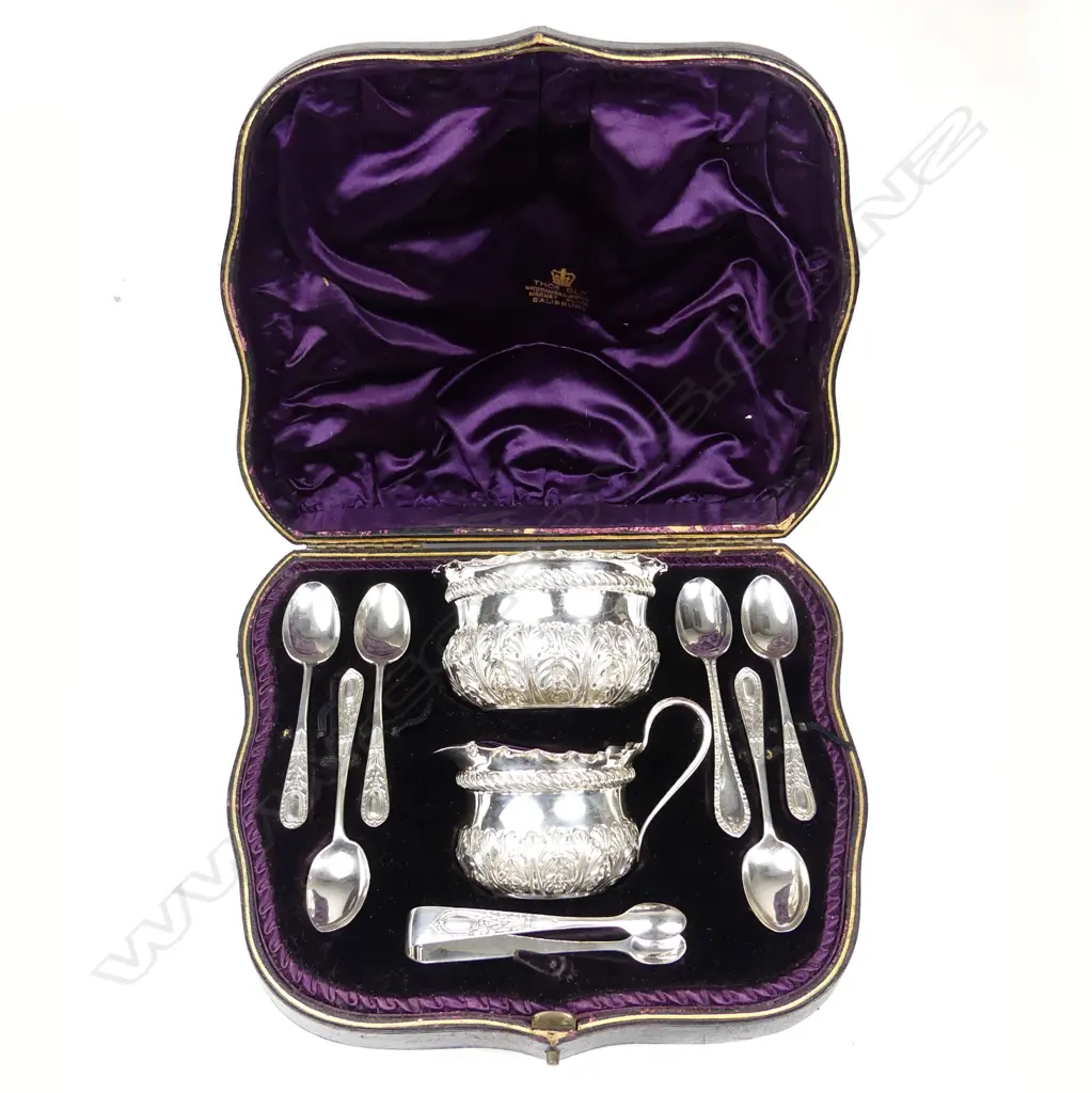 A cased Victorian silver set of sugar basin cream jug six spoons and a pair of tongs Image 1++