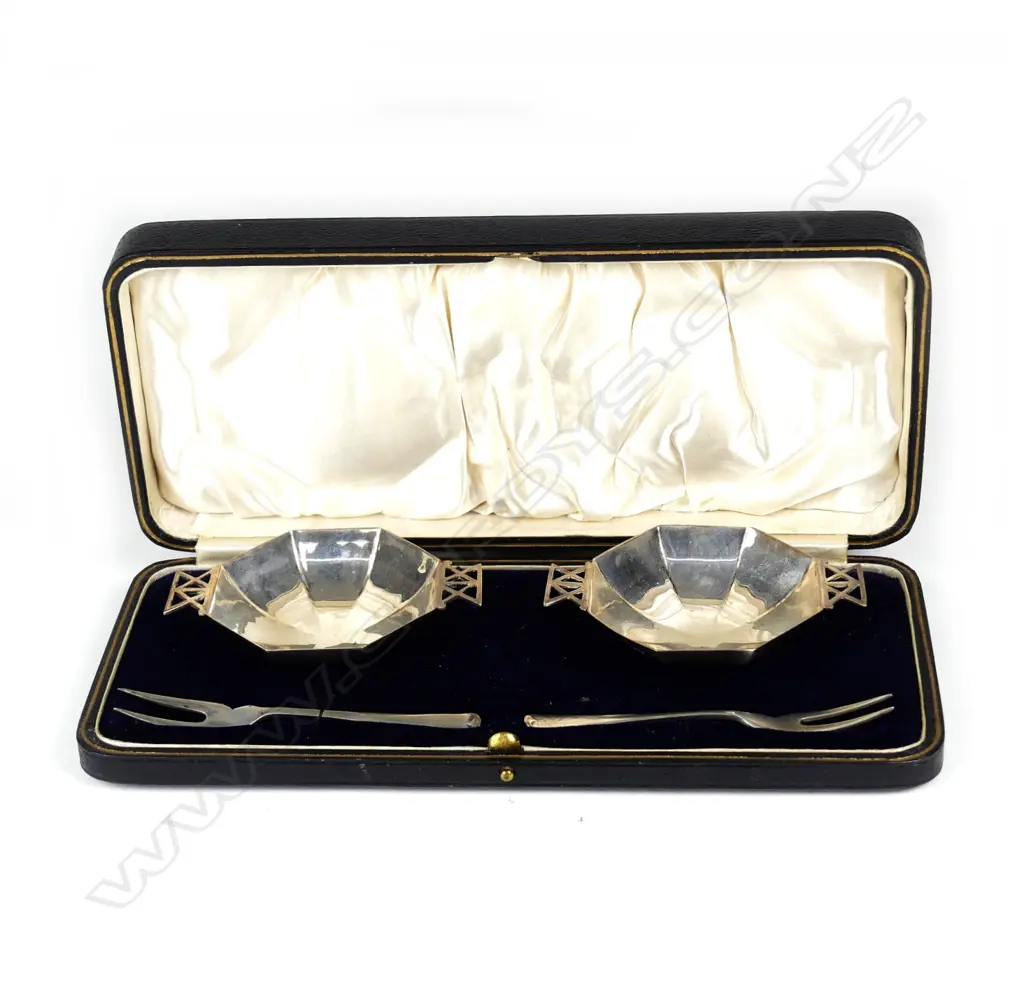 A pair of small silver octagonal petit fours dishes and forks Image 1++