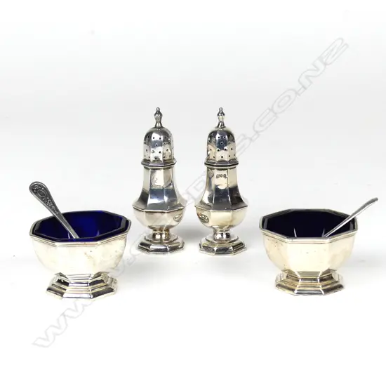 A pair of octagonal vase shaped pepperettes