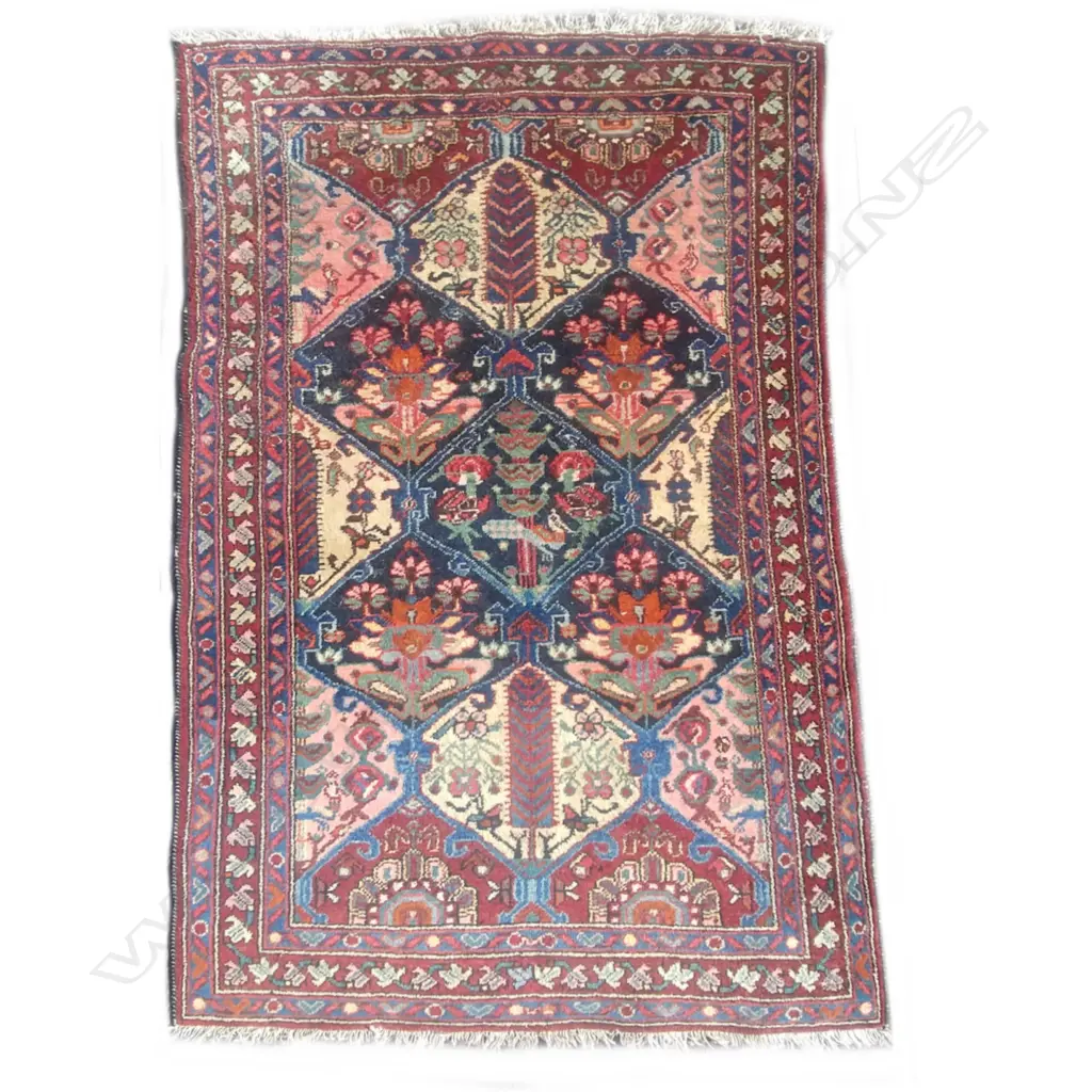 A hand knotted Persian rug Image 1++