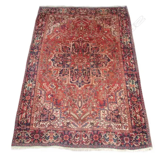 A large hand knotted Persian rug