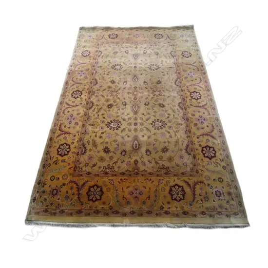 A large hand knotted Indo-Persian rug