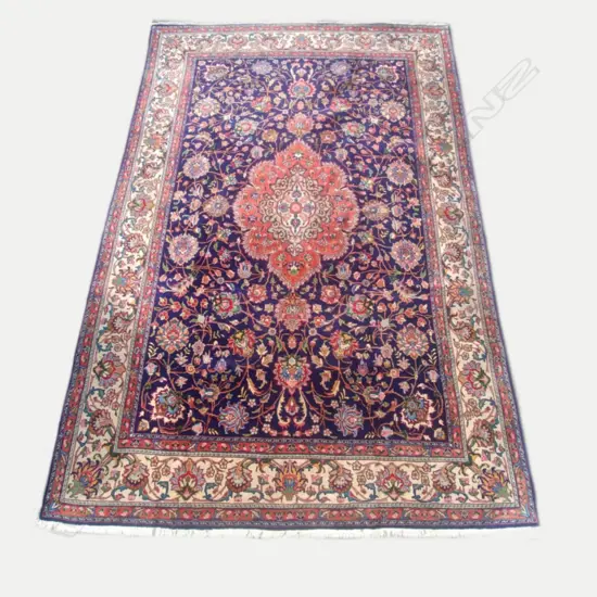 A large hand knotted Iranian Tabriz carpet