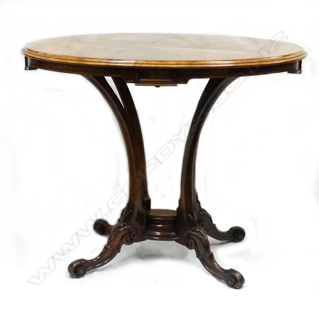 A Victorian oval walnut side table Image 1++