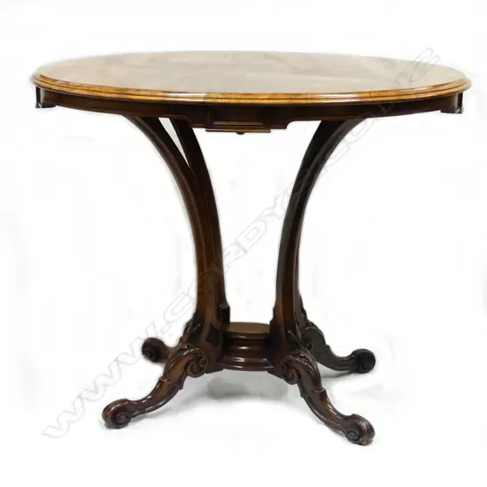 A Victorian oval walnut side table