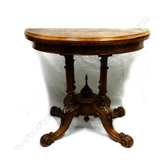 A Victorian walnut card table
