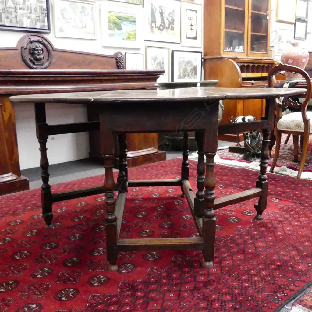 A late Georgian oak drop leaf table Image 1++
