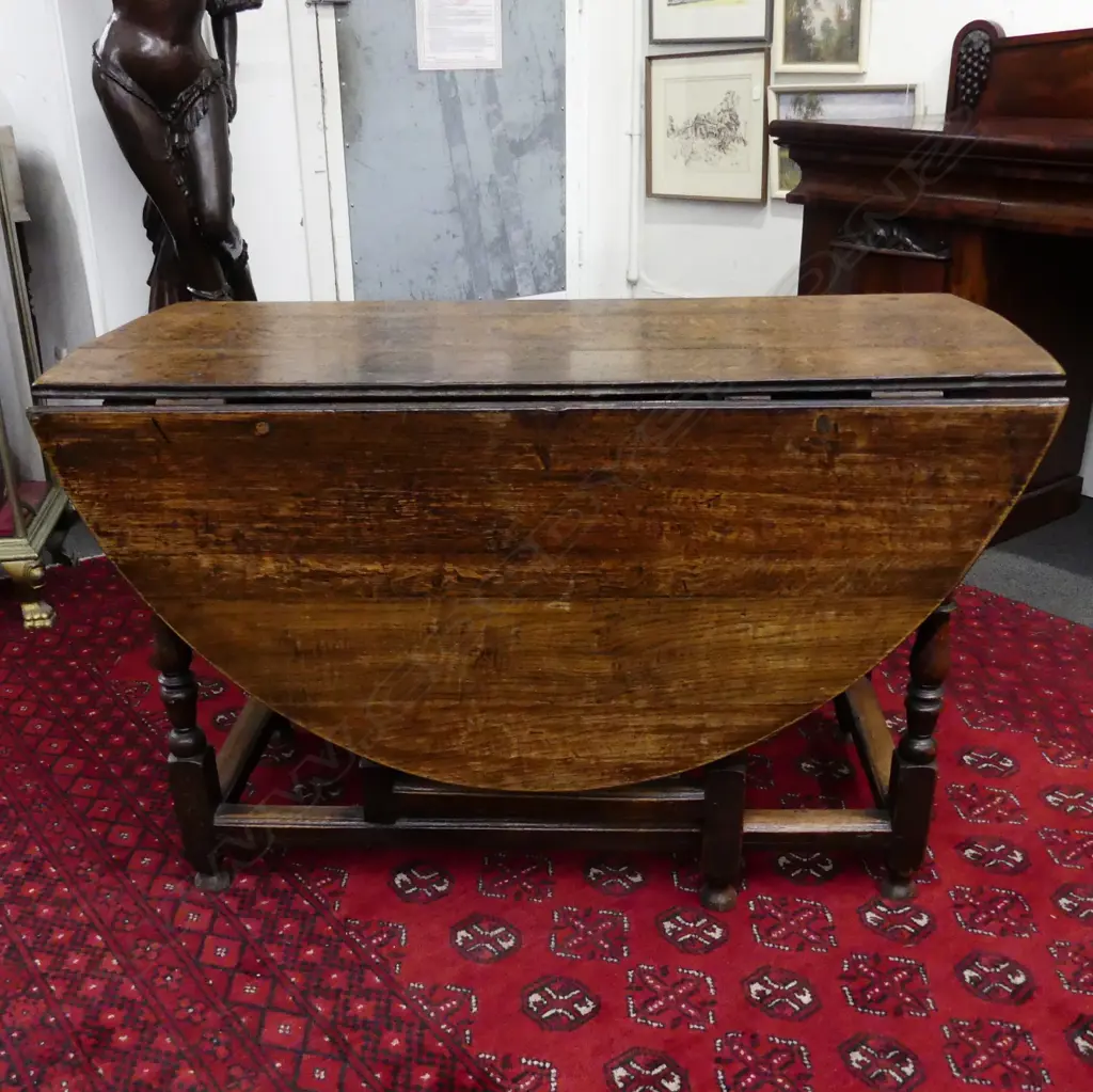 A late Georgian oak drop leaf table Image 1++