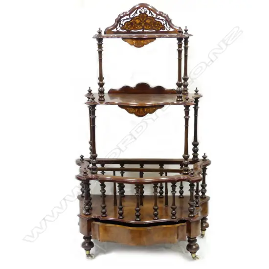 A Victorian walnut canterbury whatnot