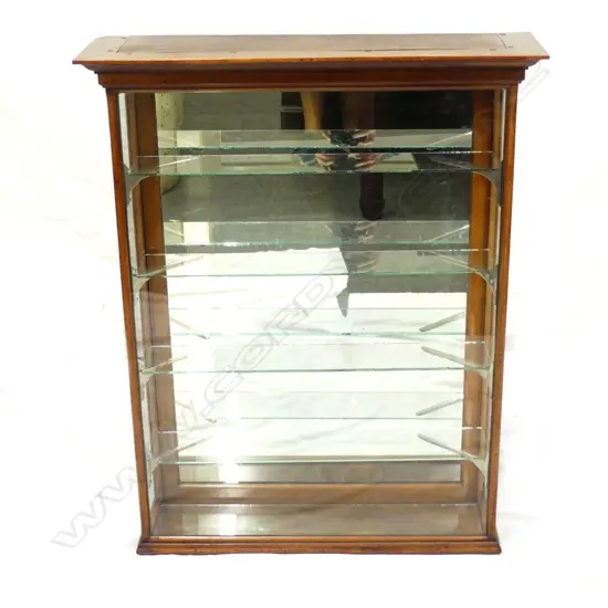 A small vintage mahogany display cabinet