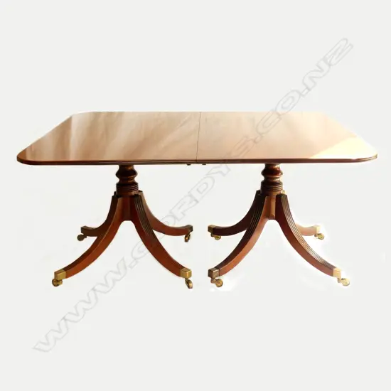 A mahogany Regency style double pedestal extension dining table