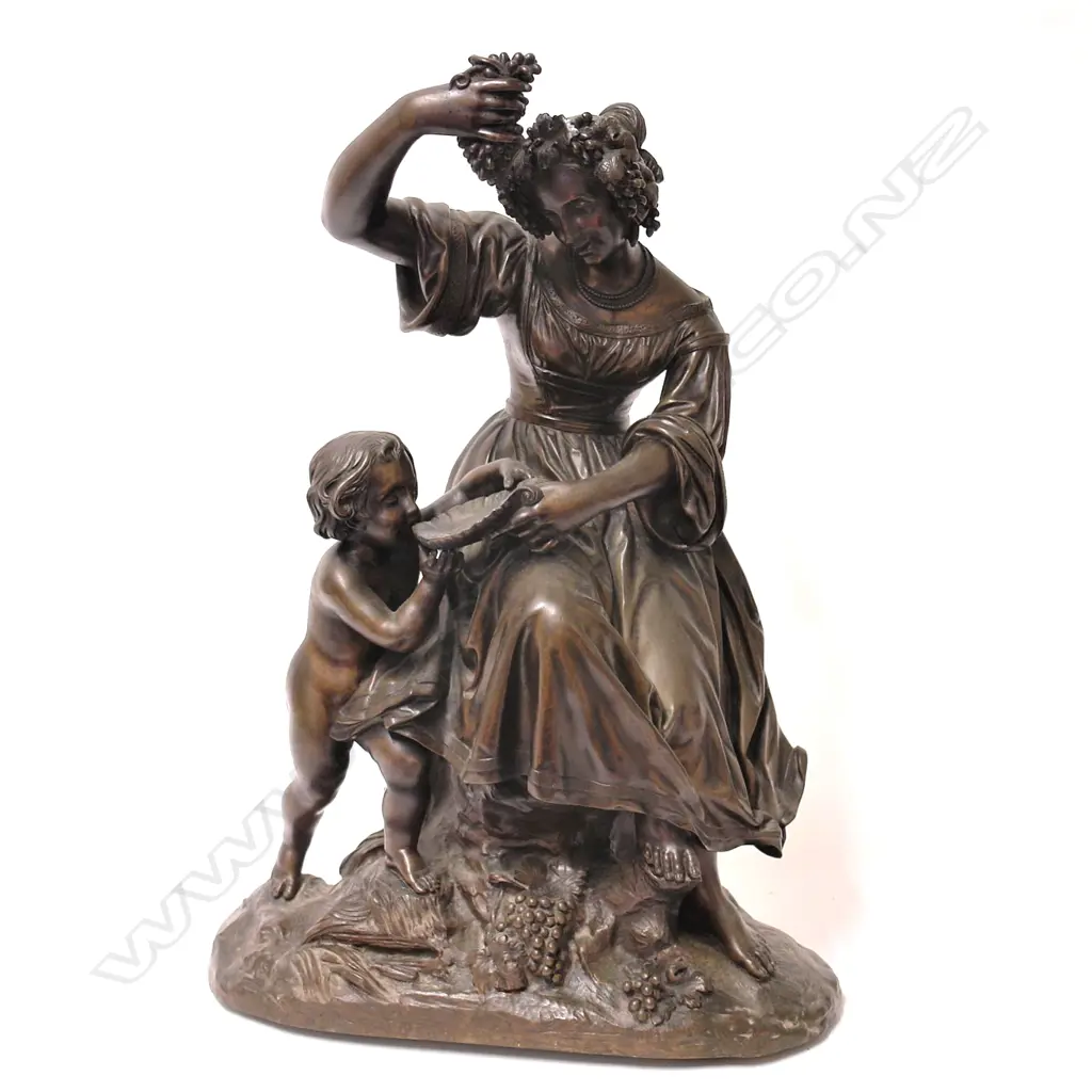 A Victorian bronze of a young woman with cherub tasting the new wine Image 1++