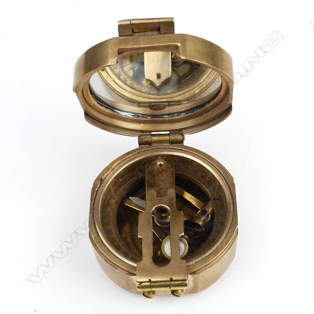 A naval brass folding pocket compass Image 1++