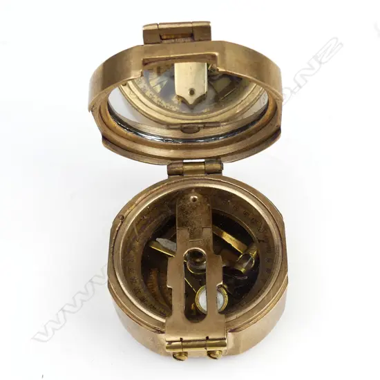 A naval brass folding pocket compass