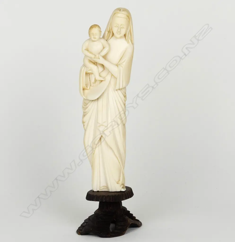 An old carved ivory standing figure of the Madonna and Child Image 1++