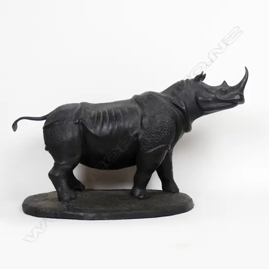 A large mid/late 20thC bronze statue of a rhinoceros