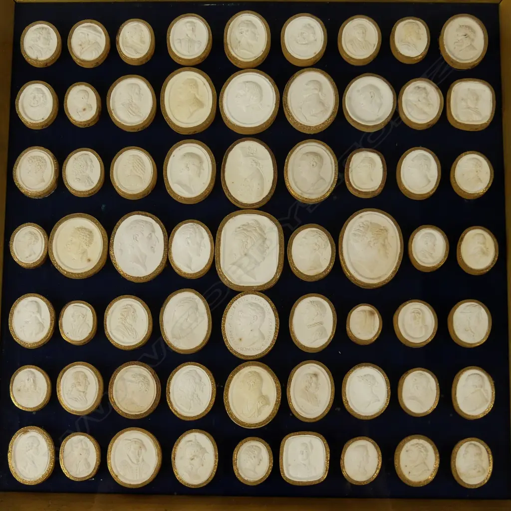 A framed group of 63 Georgian plaster cameos Image 1++