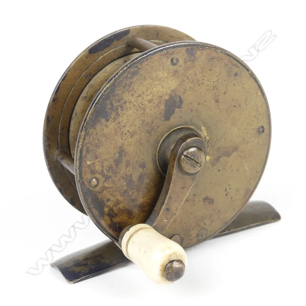 A late 19thC 2¼" brass reel Image 1++