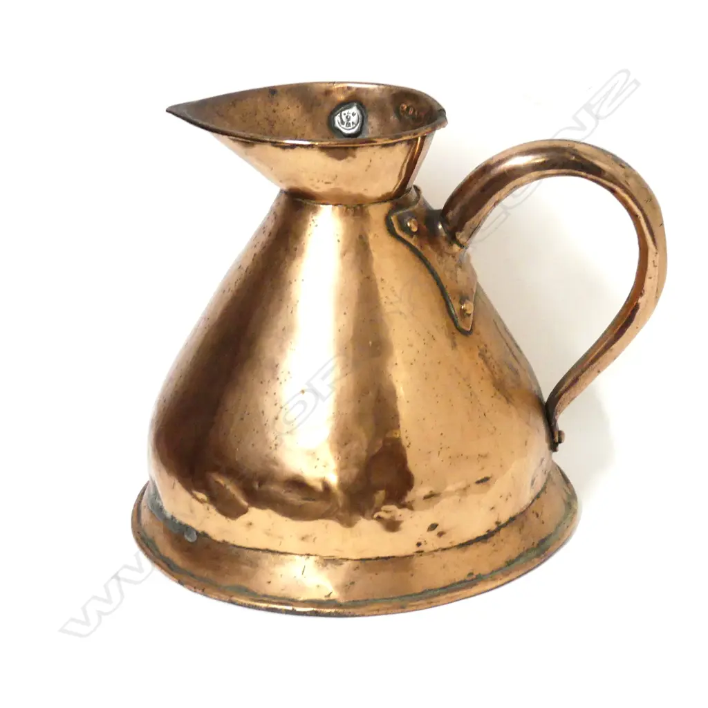 A copper one gallon measuring jug Image 1++