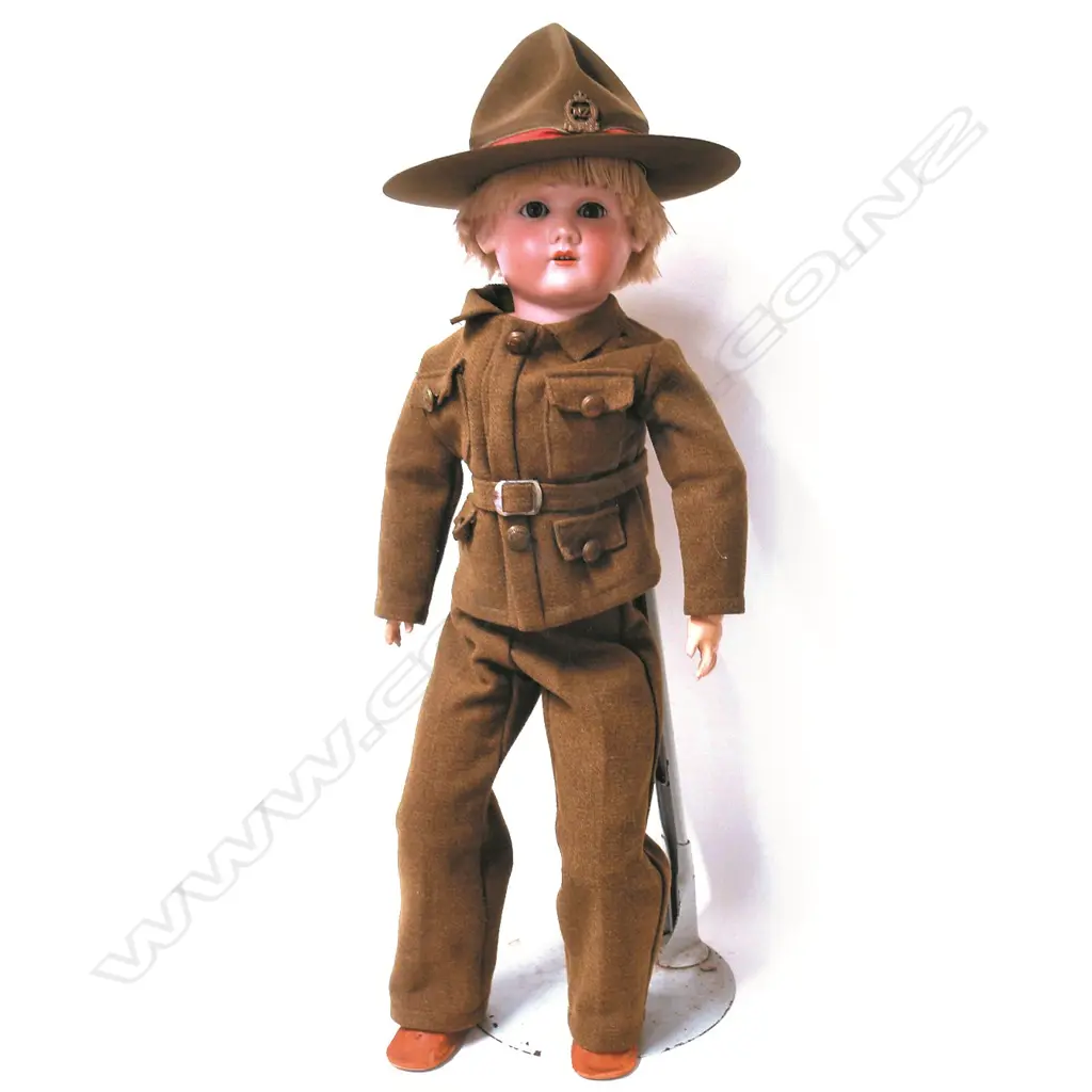 An N.Z. military dressed porcelain head doll Image 1++
