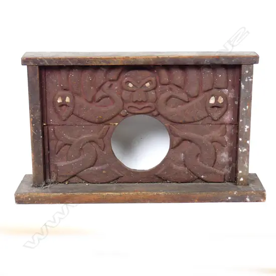A Maori folk art carved frame for a mantel clock