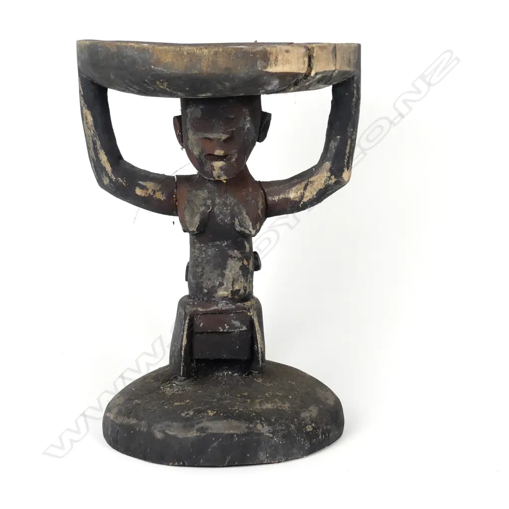 A Melanesian carved wood stool Image 1++