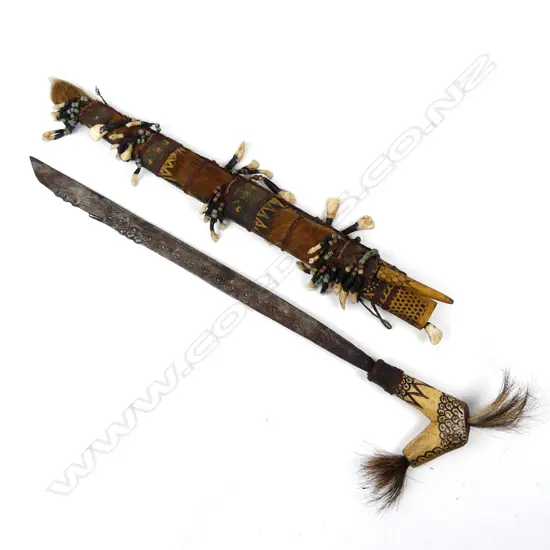 An old Borneo Dayak head-hunter’s sword (Mandau)