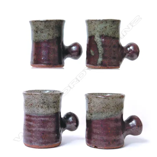 A set of four Barry Brickell knob handled small coffee mugs