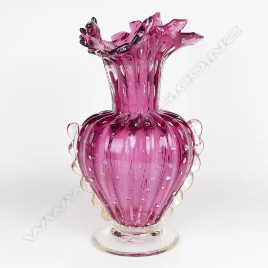 A large Italian cranberry glass vase