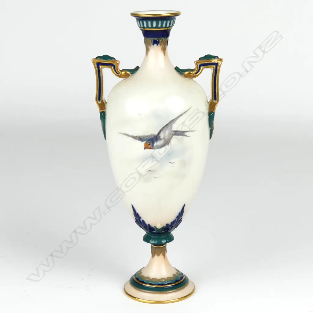 A small Royal Worcester two handled vase Image 1++