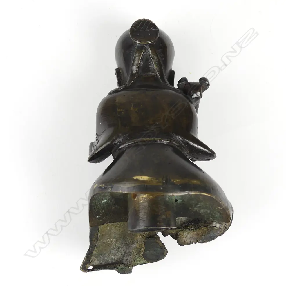 An old Chinese cast bronze figure of a seated immortal on tall wood stand Image 1++