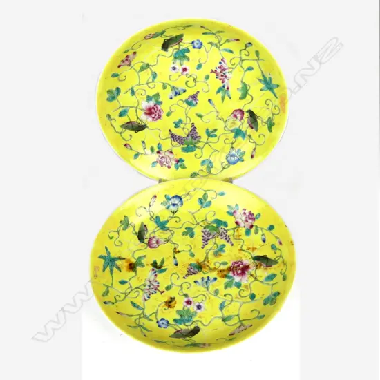 A pair of yellow ground shallow dishes