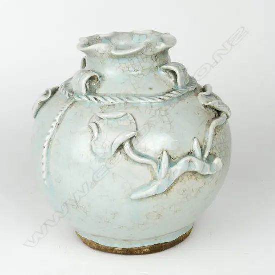 An Oriental celadon glazed spherical vase