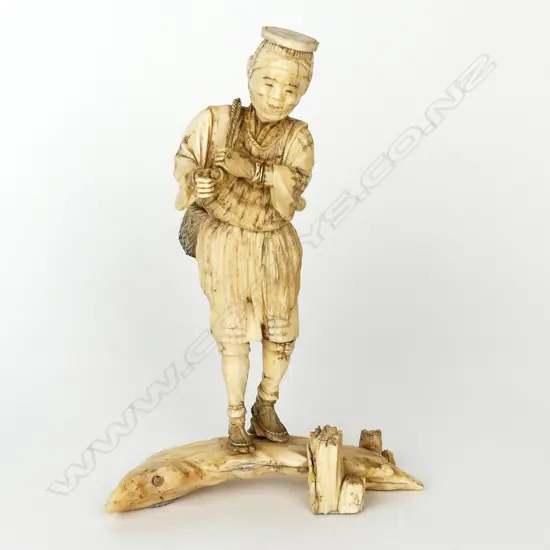 An early Meiji period Japanese ivory okimono figure