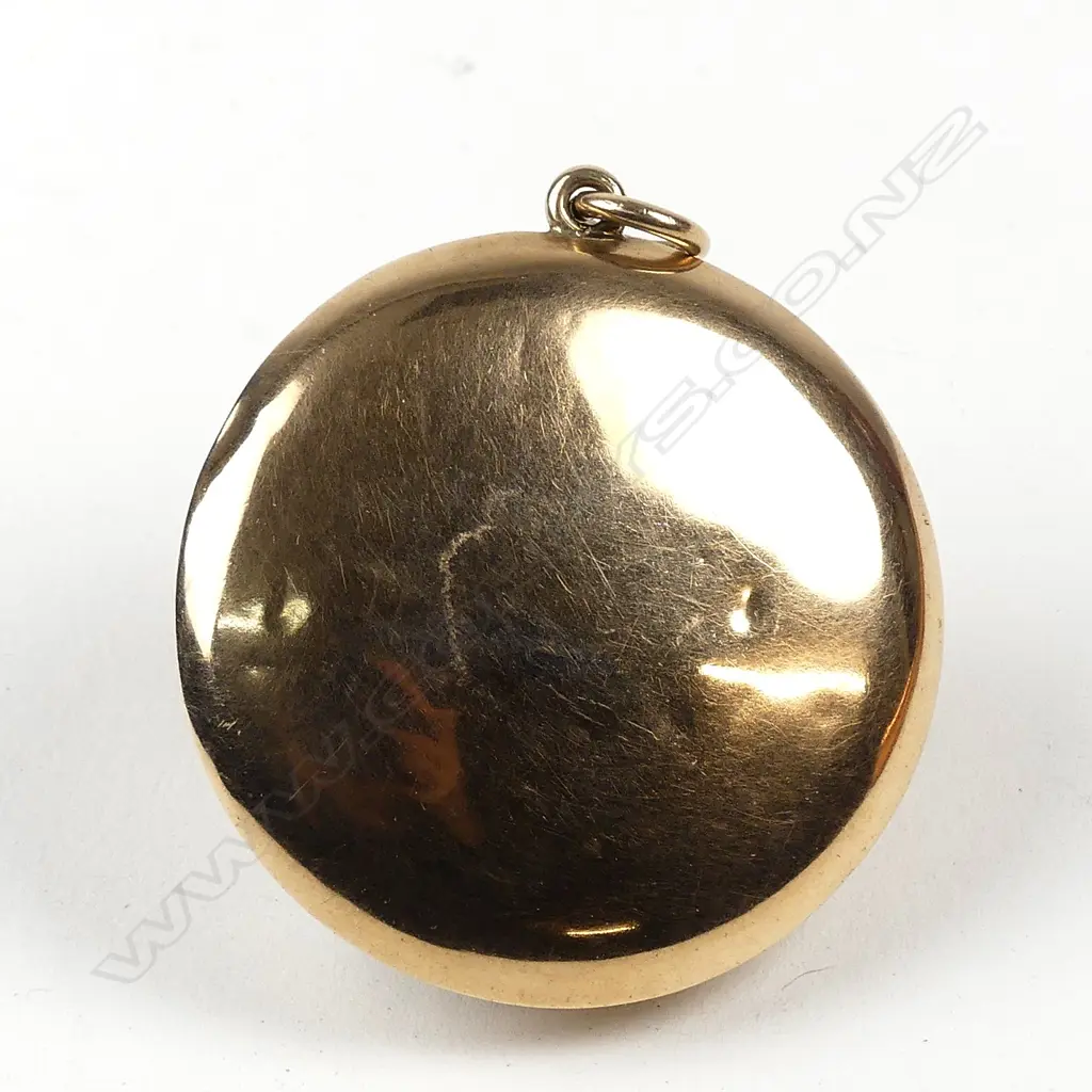 An early 1900s 9ct gold small powder compact Image 1++