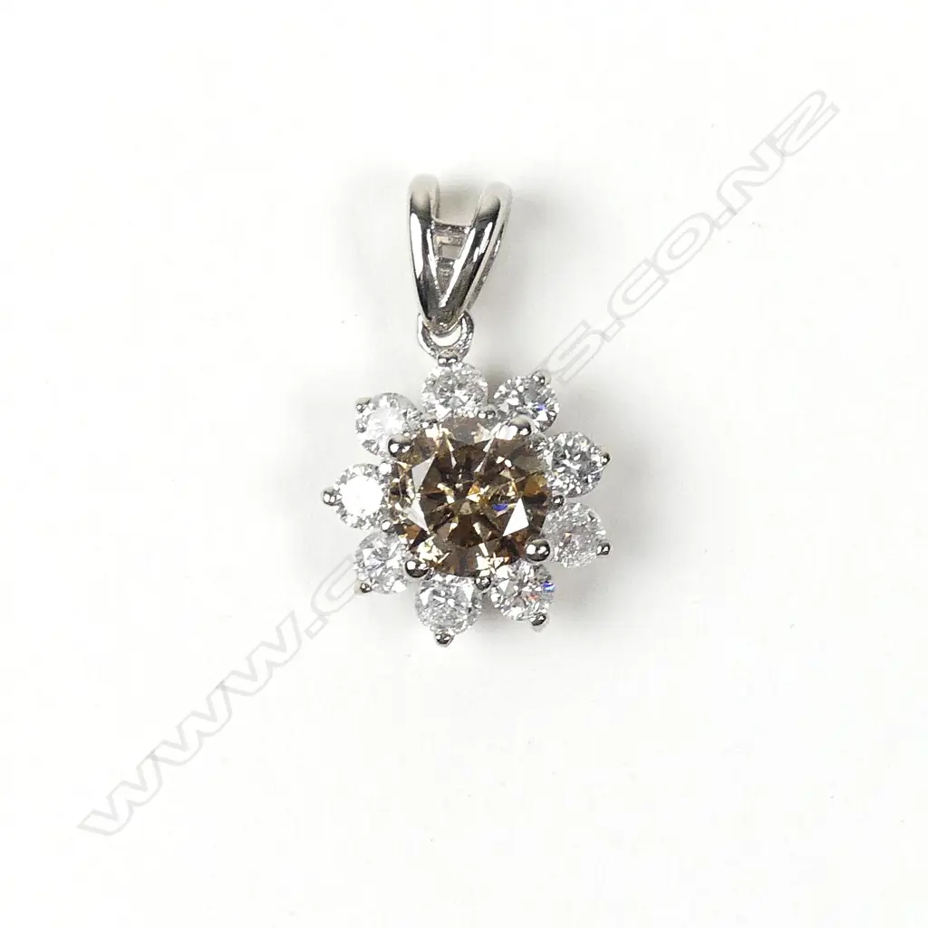 A 14ct white gold diamond pendant Image 1++