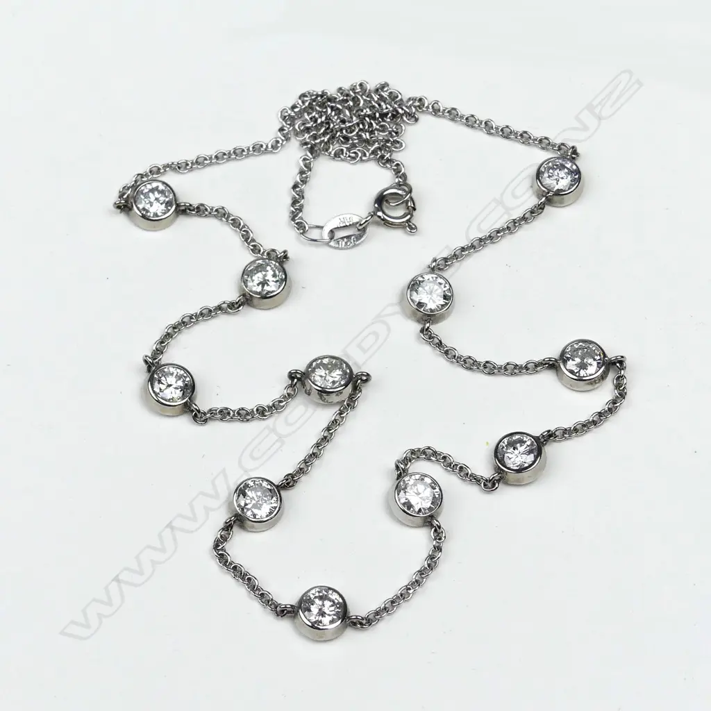 An 18ct gold  eleven diamond necklace Image 1++