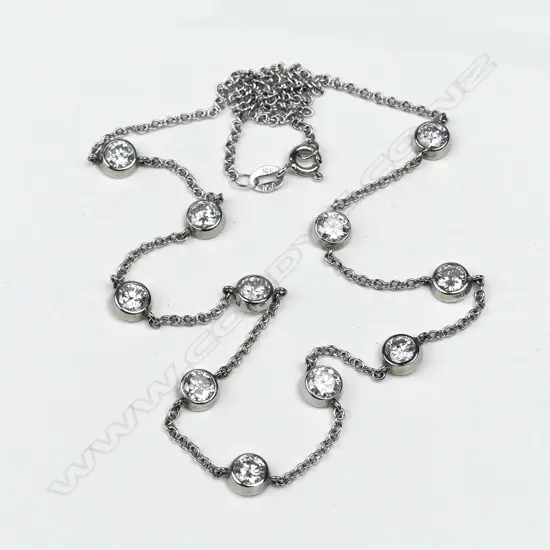 An 18ct gold  eleven diamond necklace