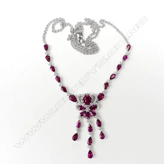 An 18ct white gold diamond and ruby necklace