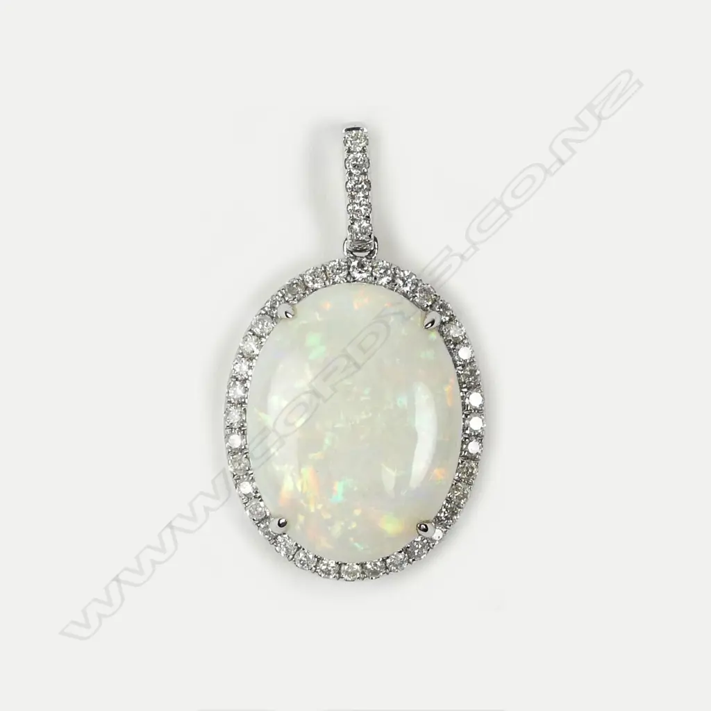 A 14ct white gold opal and diamond pendant Image 1++