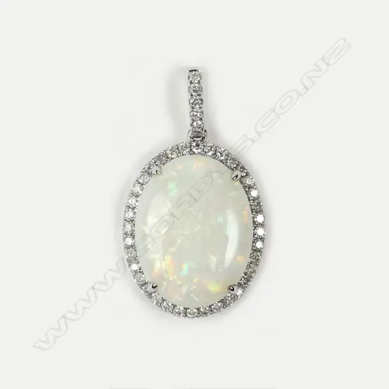 A 14ct white gold opal and diamond pendant