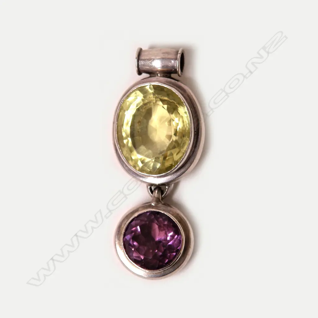 A large yellow-green beryl amethyst and silver pendant Image 1++