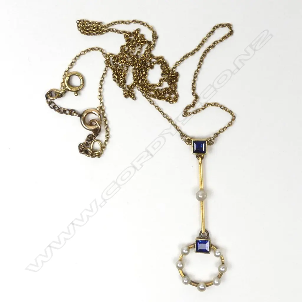 An Edwardian 9ct. yellow gold sapphire and seed pearl pendant necklace Image 1++