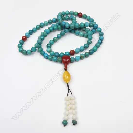 A turquoise mala bead necklace