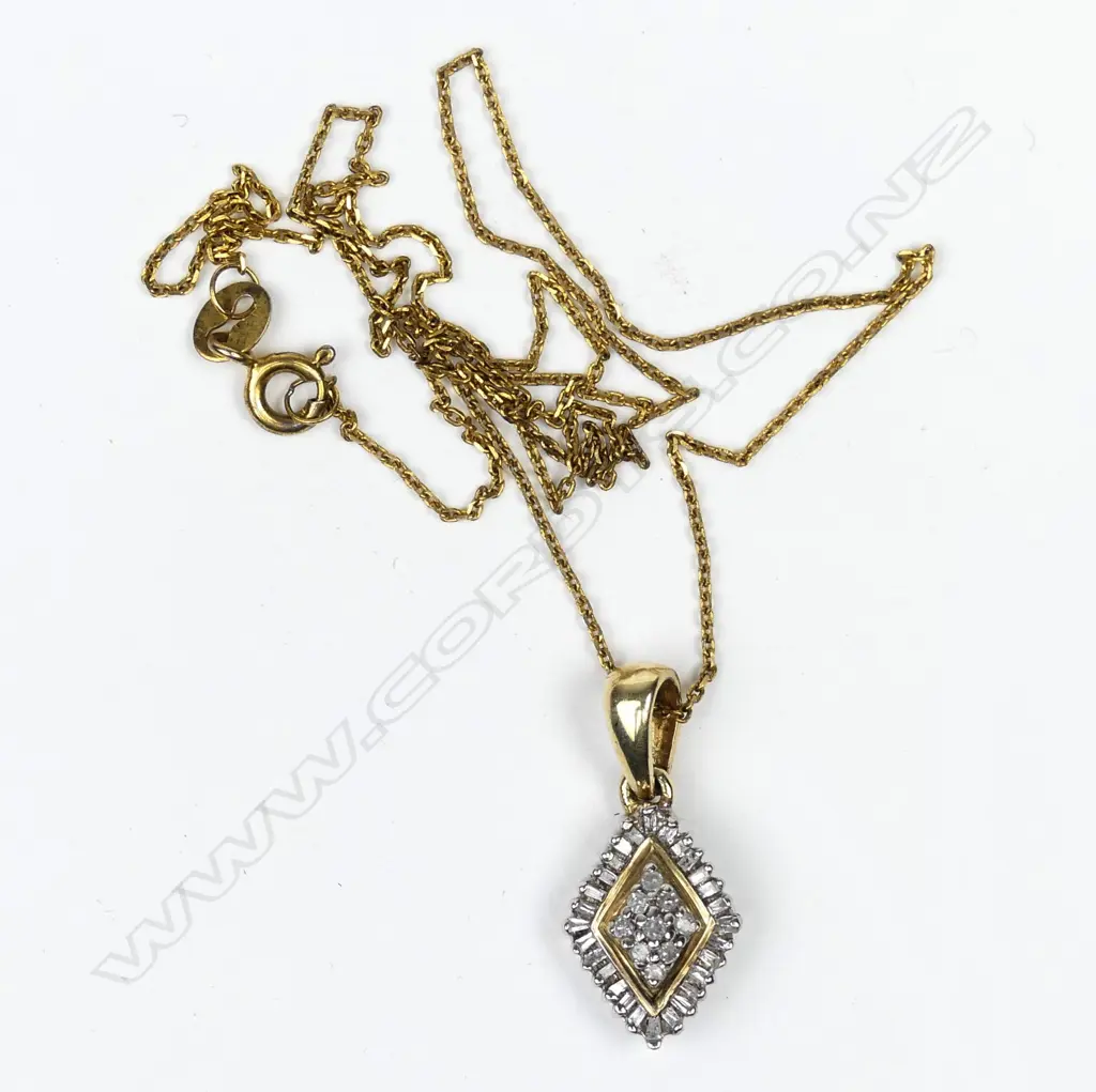 A 10ct gold and diamond pendant Image 1++