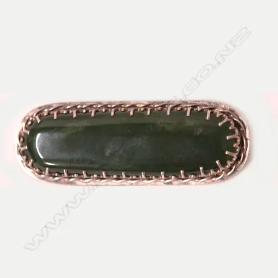 A vintage N.Z. silver and greenstone brooch